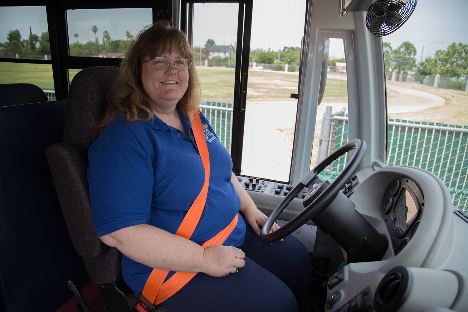 Twin Rivers Unified School District School Bus Driving Instructor Nancy Jensen sits in a new electric School bus. 
